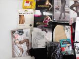 many different types of stockings on display on the wall