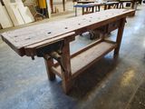 a workbench in a building with a lot of wood on it