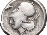 a close up of a silver coin with a woman on it