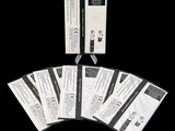five packets of white paper with black writing on them