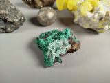 many different colored rocks on a white surface