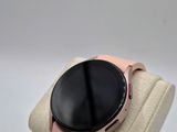 a smart watch sitting on top of a display case