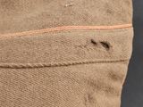 a close up of a brown bag with a zipper on it