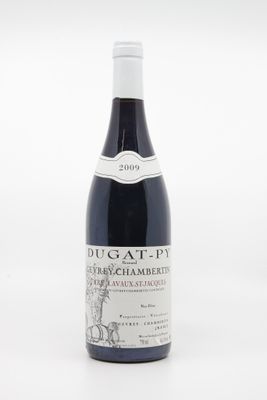 la bouteille de vin est posée sur une surface blanche