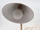 a white lamp that is on top of a table