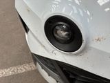 a close up of a car ' s front bumper with a speaker on it