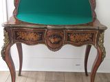 a small table with a mirror on top of it