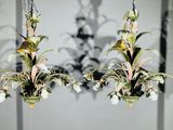 two chandeliers hanging from the ceiling of a room