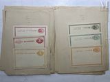 two old books with stamps on them sitting on a table
