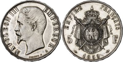 a close up of a silver coin with a crown on it