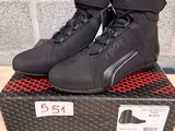 a close up of a pair of motorcycle shoes on a box