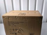 the box is sitting on the table next to the wall
