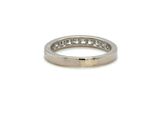 a close up of a white gold wedding ring with diamonds