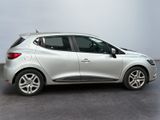 a picture of a silver car that is parked in a garage