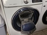 a washer and a dryer in a small room
