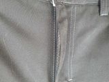 grey pants with zippers on the side and a zipper down the side