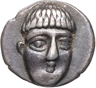 a close up of a coin with a man ' s face on it
