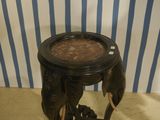 a small table with an elephant ' s head on it