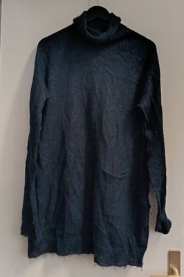 an image of a black shirt hanging on a wall