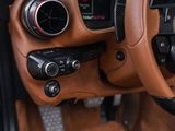 a close up of the steering wheel and dashboard of a sports car