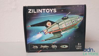 a box with a model of a space ship in it