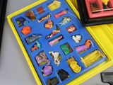 a yellow box with a bunch of toys inside of it