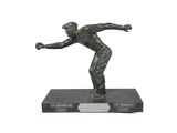 bronze statue of a baseball player throwing a ball on a base
