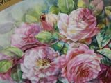 a painting of a bouquet of pink roses on a plate