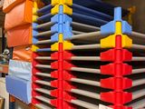 a large rack with many different colored bins on it