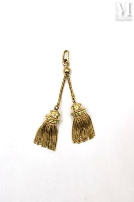 two tassels hanging from a hook on a white background