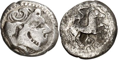 a silver coin with an image of a man on it