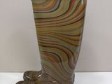 a glass vase that is sitting on a table