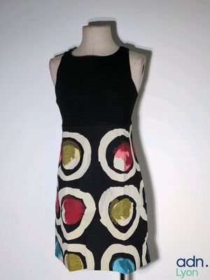 a dress on a mannequin on a white background