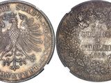 a close up of a coin with an eagle on it
