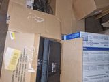 many boxes of electronic equipment sitting on the floor