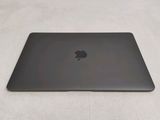 an apple macbook pro laptop computer sitting on top of a white surface