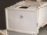 a small white box with a blue and white design on it