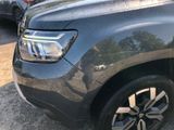 a close up of a car ' s headlight on the side of the road