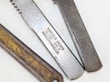 three different types of wrenches on a white surface