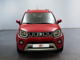 the front view of a red suzuki suv parked in a room