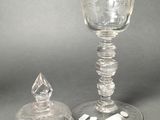two wine glasses sitting next to each other on a table