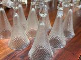 a lot of wine glasses sitting on a wooden table