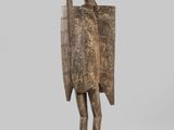 a wooden sculpture of a bird with a long neck and legs