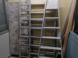 a ladder that is leaning against a wall in a room
