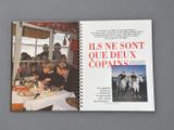 a book with a picture of a group of people sitting at a table