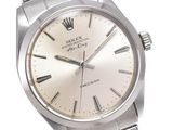 an image of a stainless steel wrist watch with a white dial