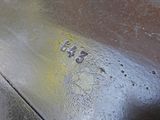 a close up of a metal object with some paint on it