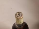 a bottle of liquor sitting on a white surface