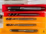 many different types of drill bits in a plastic case
