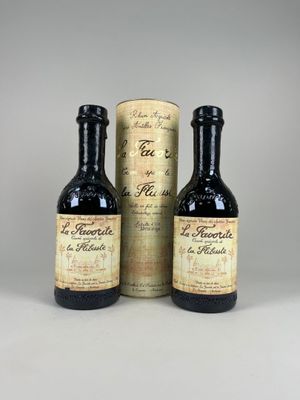 trois bouteilles de vin posées l'une à côté de l'autre sur une table